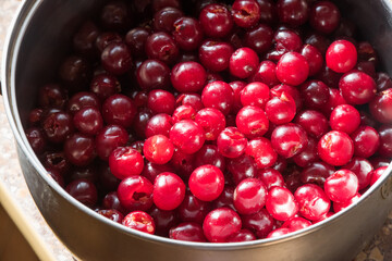Background of fresh ripe pitted cherries