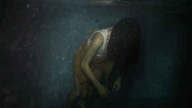 Woman floats inert at night
