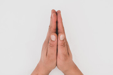 Isolated hispanic hands praying