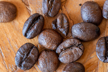 coffee beans on the wooden table macro 100mm