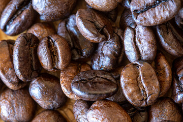 coffee beans on the wooden table macro 100mm