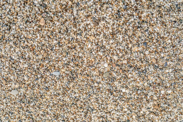 The texture of coarse sand near. Macro.