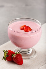 Delicious strawberry mousse in glass goblet.