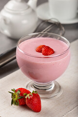 Delicious strawberry mousse in glass goblet.