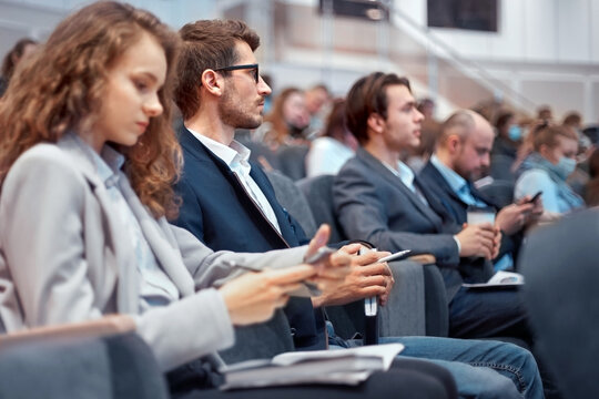 young business people using their smartphones during the workshop.