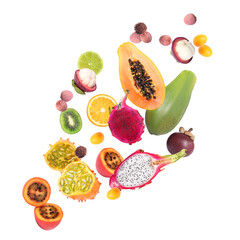Different tasty exotic fruits flying on white background