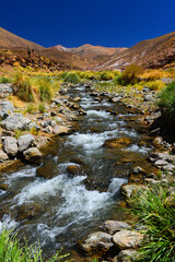 A crystal clear mountain river flowing down the Andes near the Abra del Acay pass, La Poma, Salta Province, Argentina