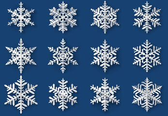 Fototapeta na wymiar Set of beautiful complex paper Christmas snowflakes with soft shadows, white on blue background