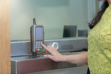 Mexican woman customer at bank office wearing face mask after coronavirus pandemic, savings and finance concept
