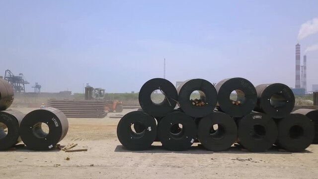 Drone shot of black metal coil rows, outside at the Ennore Port in Chennai, India