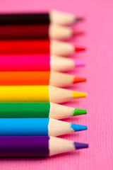 Set of Rainbow Colored Pencils on a Bright Pink Background