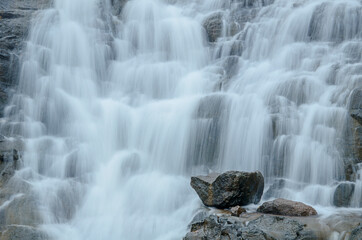 Beautiful waterfall falling on the steps