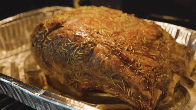 A big Fresh Slice of Prime Rib Hot and well Roasted Inside Oven. Slow Motion