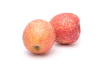 Two fuji apples isolated on white background. Healthy food