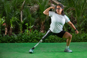 Mexican woman with prosthetic leg exercising outside 