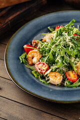 Shrimp and arugula salad with tomatoes and parmesan