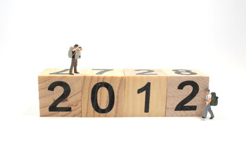 the mini travel figure on wooden cube to 2012