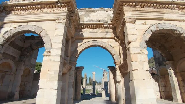 Walking through The Gate of Mazeus and Mithridates showing Agora commercial marketplace in Ephesus.