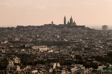Fototapeta na wymiar aerial view of the city of paris against the background of the church of the sacred heart in the afternoon