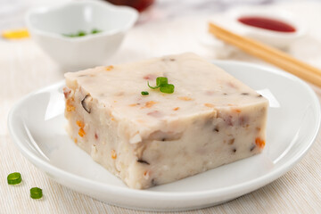 Steamed chinese radish cake, turnip cake or daikon cake ready to be served