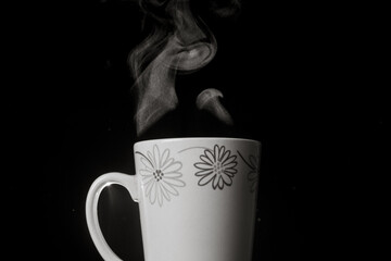 detail of a cup in black background smoke extractor