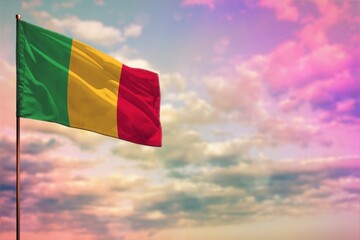Fluttering Mali flag mockup with the space for your content on colorful cloudy sky background.