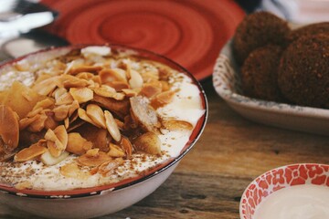 Closeup image of Palestinian food, fatteh & falafel on plate 