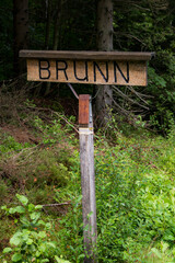 Boras, Sweden A wooden sign in the forest saying 