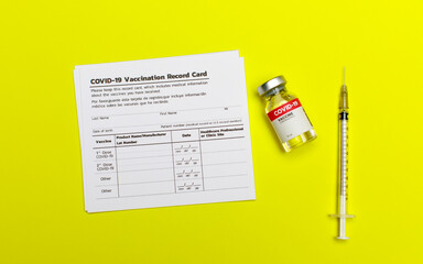 Covid-19 vaccination record card including info of patient, dose, product lot, injection date,...