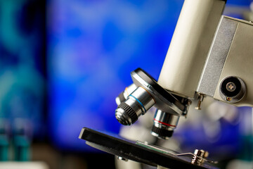 High technology scientific microscope with lens objectives for efficient magnification to observe or diagnose microorganisms or pathogenic bacteria in biology research or chemistry lab.