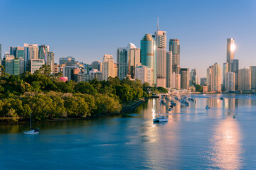Fototapeta na wymiar Brisbane city buildings and river seen in early morning light from Kangaroo Point. Brisbane is the state capital of Queensland, Australia.