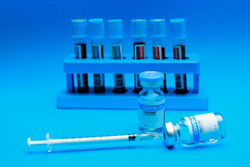 Medical hygiene syringe with needle incline on sealed glass capsule of transparent liquid as...