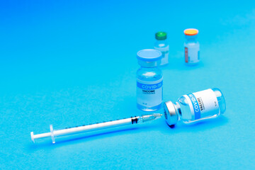 Medical hygiene syringe with needle incline on sealed glass capsule of transparent liquid as...