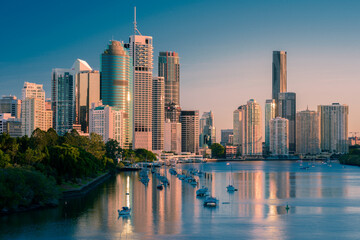 Naklejka na ściany i meble Brisbane city buildings and river seen in early morning light from Kangaroo Point. Brisbane is the state capital of Queensland, Australia.