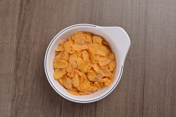 Chinese New Year festival colourful Yu Sheng Lo Hei salad with smoked salmon fish, cracker cookies and sweet sauce on wood background asian halal menu