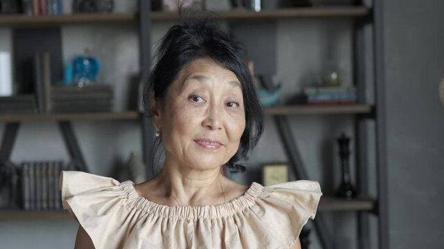 portrait of an elderly asian woman at home