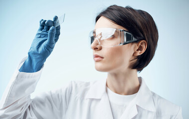 female laboratory assistant in a white coat analysis diagnostics biology