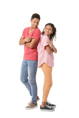 African-American brother and sister on white background