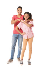 African-American brother and sister bumping fists on white background