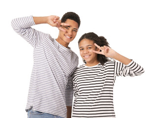 African-American brother and sister showing victory gesture on white background