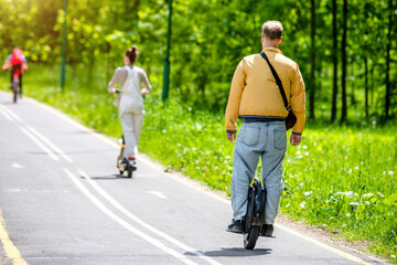 The guy rides on a one-wheeled gyro scooter © licvin