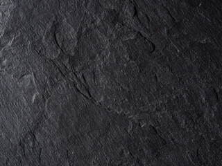 Rough graphite background. cheese cutting board   