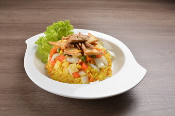 vegetarian nasi goreng fried rice with pineapple, vegetables meat in spicy chilli sambal sauce on wood background asian halal vegan menu