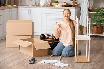 Young woman assembling furniture at home