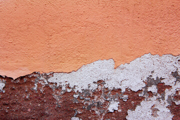 Crack wall texture in orange and red tones. Background.