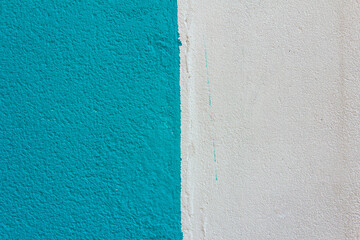 Fototapeta premium Blue wall texture with grain and white paint. Background.