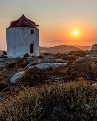 Fototapeta premium scenic golden hour view of a traditional wind mill in Chora Amorgos Greece