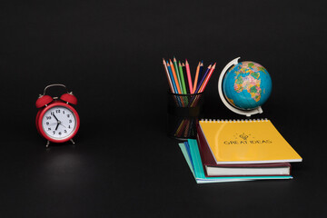 colorful collection of school supplies set on black background. back to school. great ideas