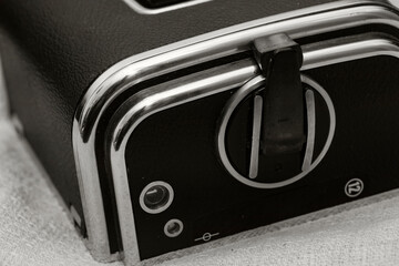 abstract close-up of vintage old camera in black and white