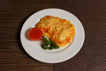 chicken chop with cheese and sauce